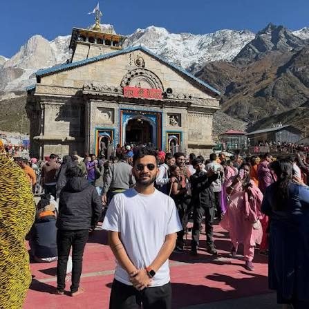 Traveler at Kedarnath temple courtyard